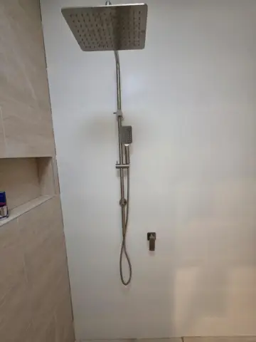 Brushed nickel shower set with tiled niche