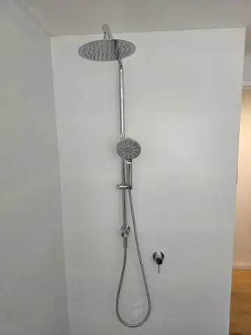 Chrome twin shower with rail and rain head