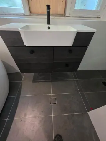 Semi-recessed basin on a dark vanity