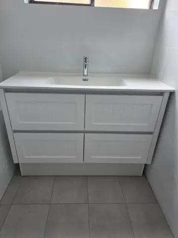 Shaker-style double-drawer vanity installed