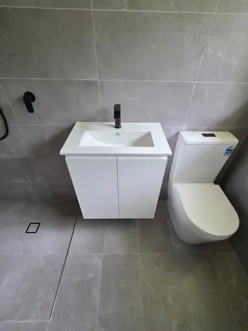 Wall-hung vanity and toilet in a new bathroom