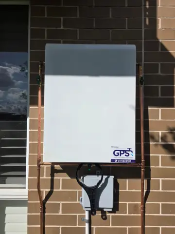 Whole-house water filter system with cover, installed by GPS